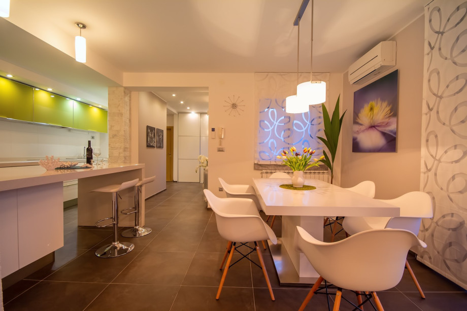 air-conditioned living and dining area with a fully equipped kitchen