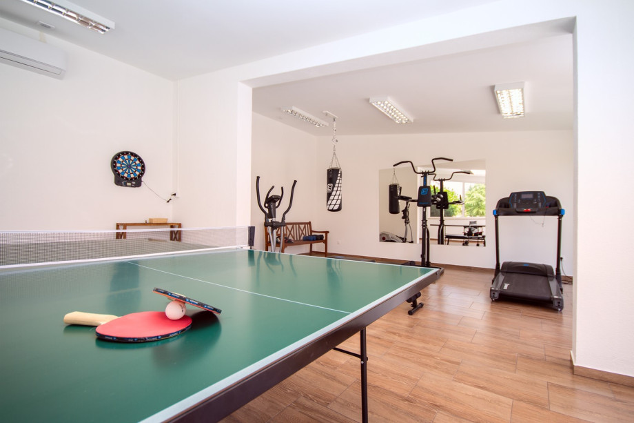 a well-equipped gym and a table tennis setup to ensure you can stay active and entertained during your stay