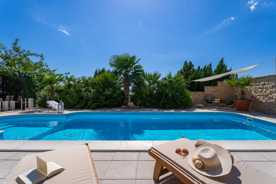 32 square meters pool, with 8 deck chairs