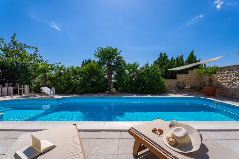 32 square meters pool, with 8 deck chairs