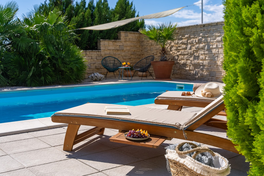 32 square meters pool, with 8 deck chairs