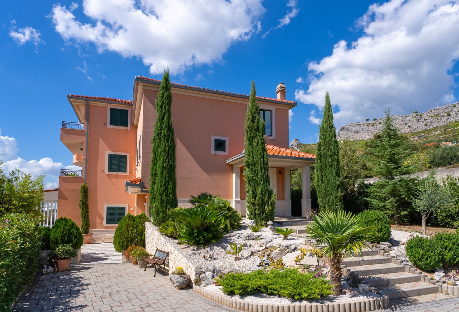 a private entrance through a gated driveway, providing security and exclusivity