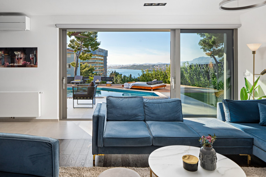 The glass walls facing the pool on the ground floor provide an exceptionally light living area