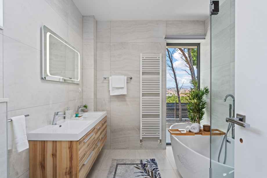 An en suite bathroom with a bathtub and a shower