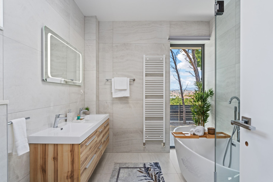 An en suite bathroom with a bathtub and a shower