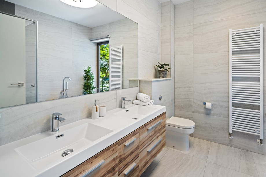 An en suite bathroom with a bathtub and shower