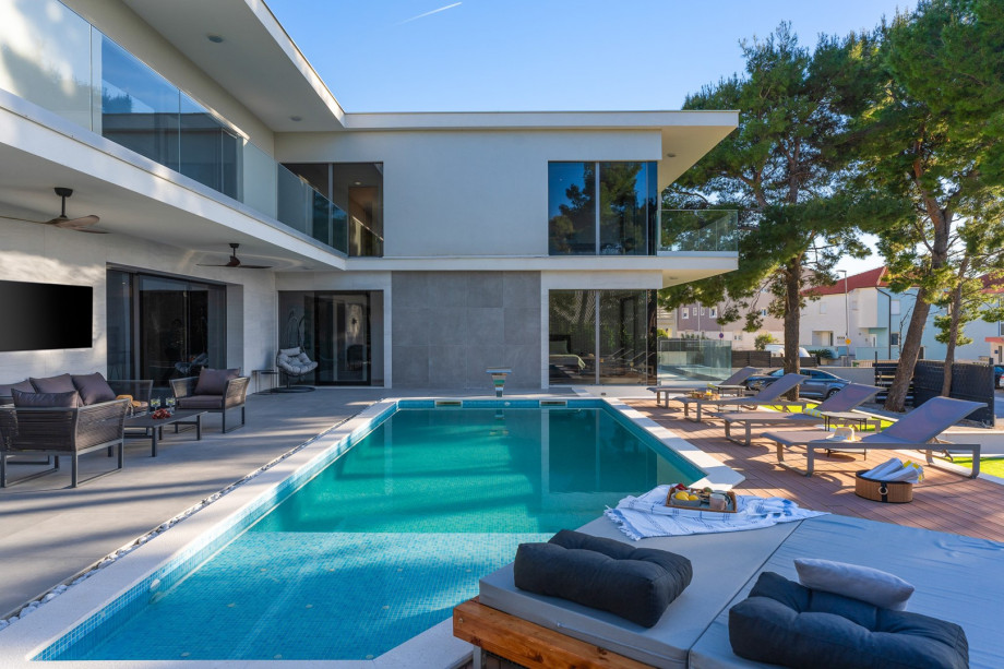 Five automobiles can be safely parked on a private plot