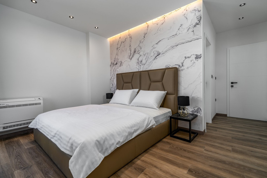 Bedroom No2 with king size bed 180cm x 200cm with sea views, en-suite bathroom with a shower, air-conditioning, a balcony with sea views