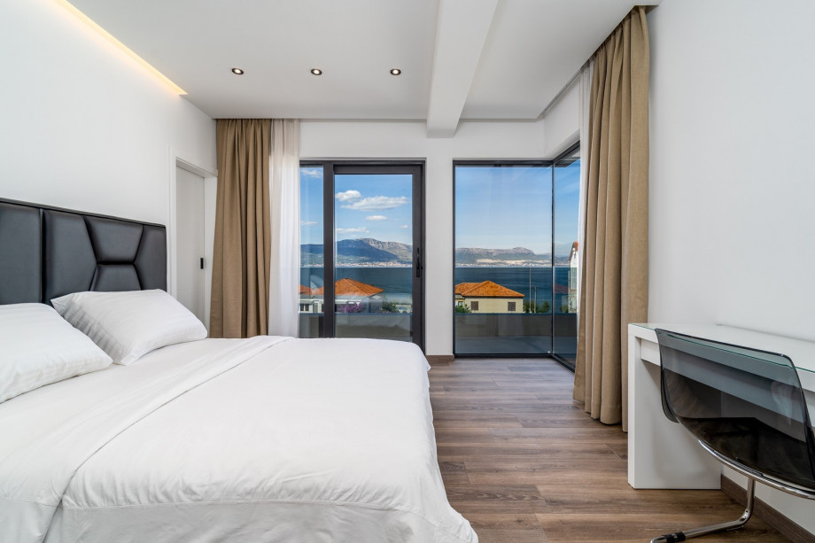 Bedroom No4 with king size bed 180cm x 200cm with a spacious balcony with opened sea views, en-suite bathroom with a shower, air-conditioned