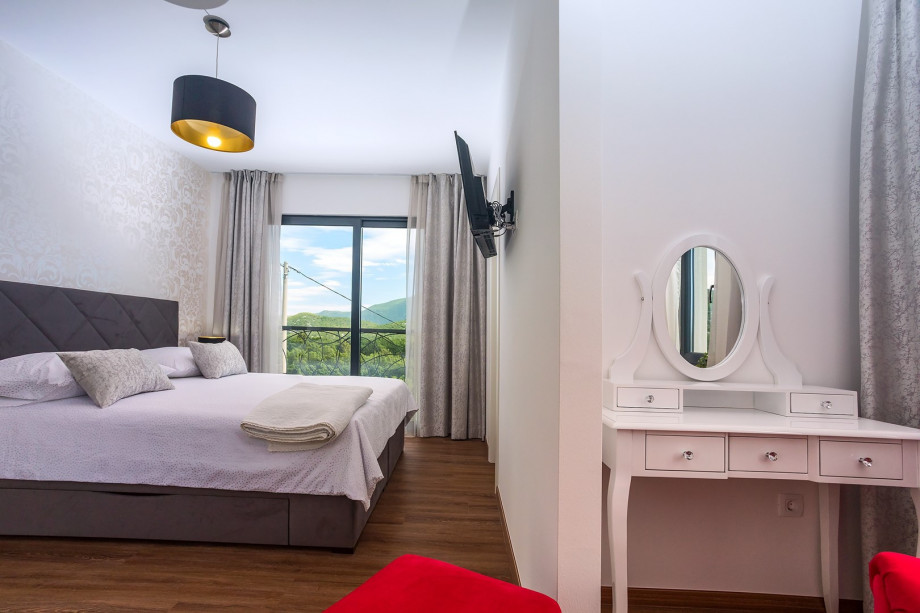 Bedroom No3 with king-size bed 180 * 200cm, TV, A/C a walk-in wardrobe and a makeup table