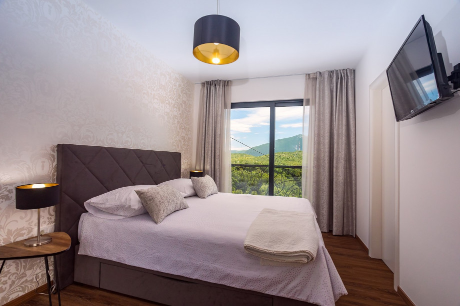 Bedroom No3 with king-size bed 180 * 200cm, TV, A/C a walk-in wardrobe with a mountain view