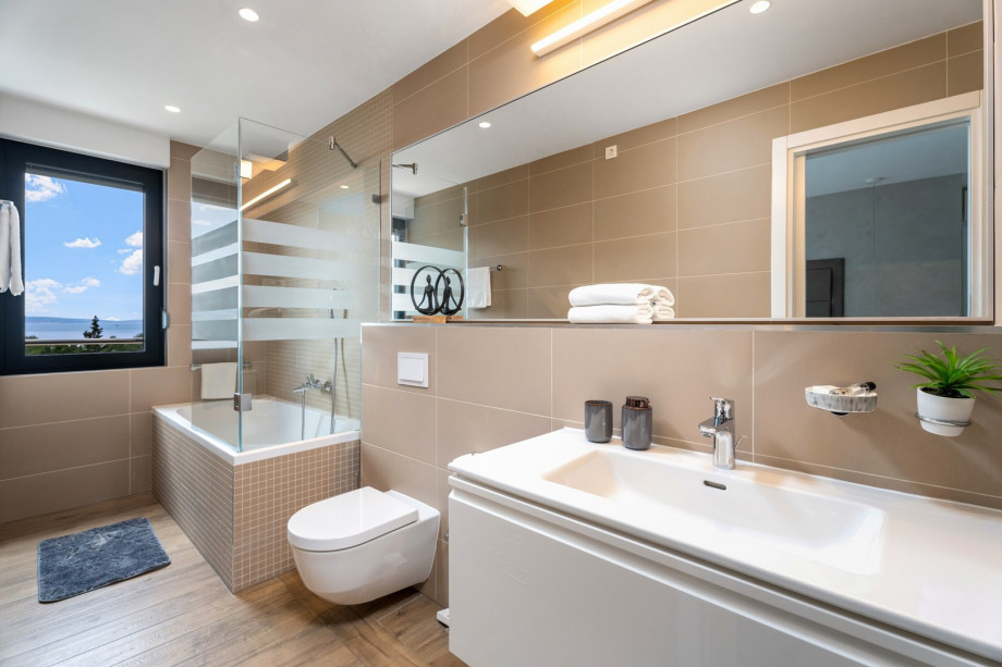 1 of 4 en-suite bathrooms with bathtub, shower, bidet and sea views