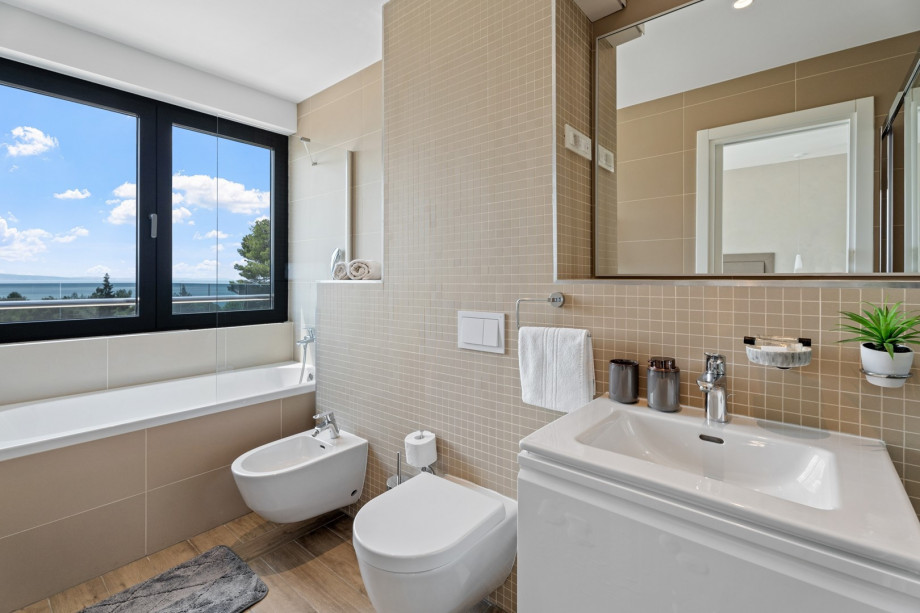 1 of 4 en-suite bathrooms with bathtub, shower, bidet and sea views