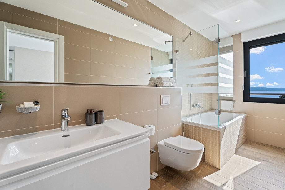 1 of 4 en-suite bathrooms with bathtub, shower, bidet and sea views