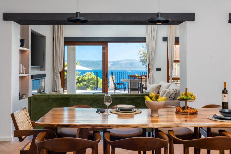 A wooden dining table for 8, sofas with flat screen TV, Netflix and HBO,