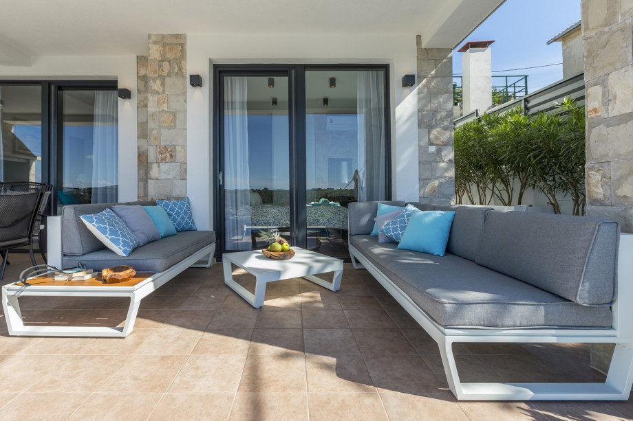 A comfortable lounge corner next to the pool area