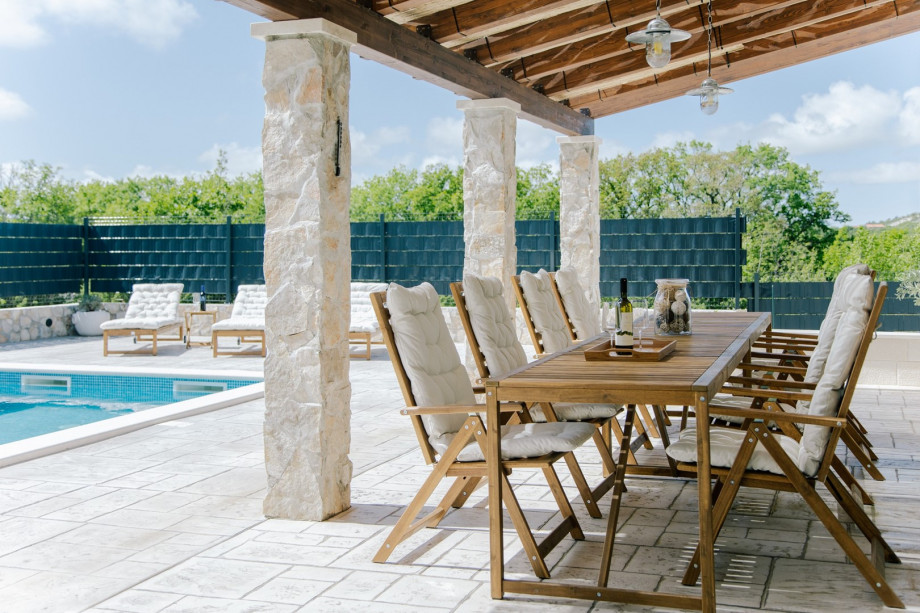 It features a generous 36sqm heated swimming pool—perfect for cooling off or soaking up the sun on warm days.
