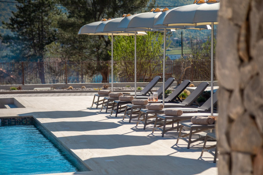 Sun deck area with 8 lounge chairs and umbrellas provides the perfect spot to relax
