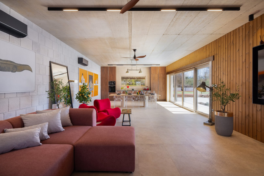 Sliding glass doors to the stunning outdoor areas, seamlessly connecting indoor comfort with nature's beauty