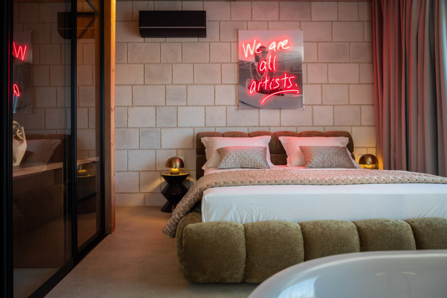 The villa also includes a laundry area with a washing machine, dryer, and ironing amenities