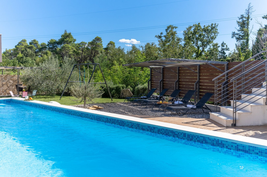 A private 28 sqm swimming pool with an automated salt electrolysis system