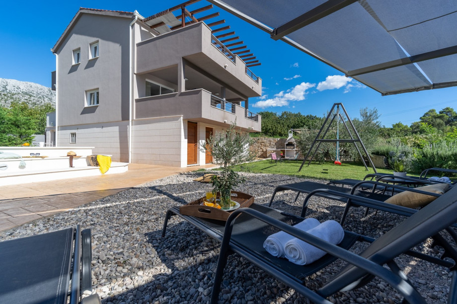 The sun deck area with 5 deck chairs