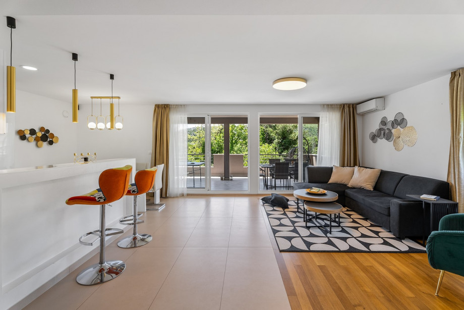 A modern living area with TV, free WiFi, a sofa