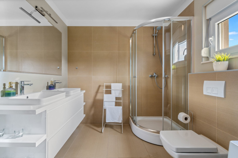 There is a family bathroom with a shower