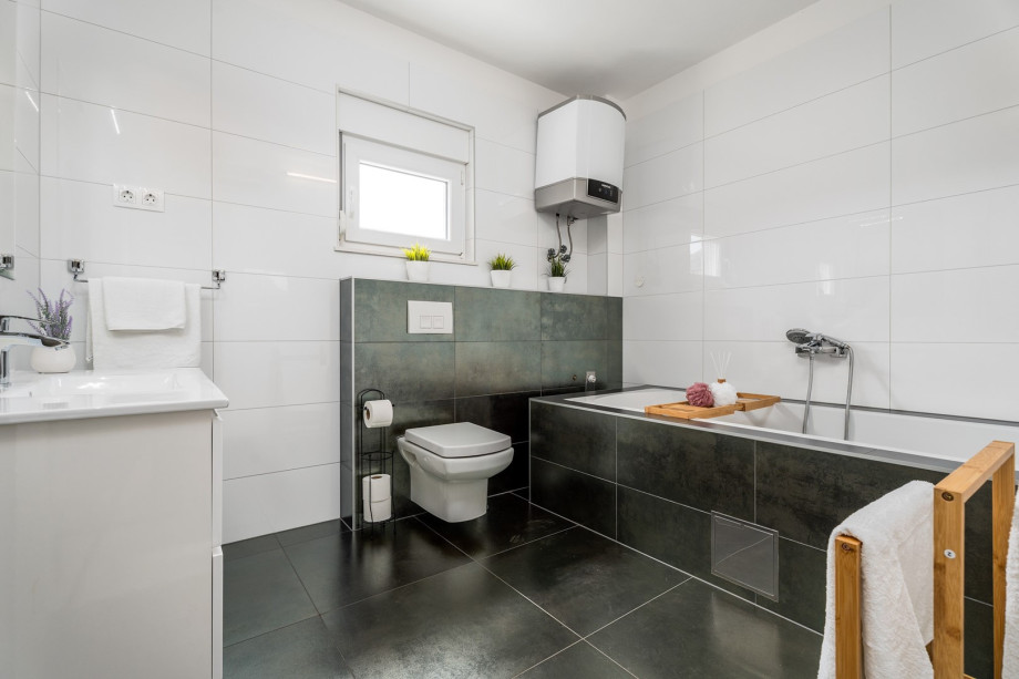 There is also a family bathroom with a bathtub