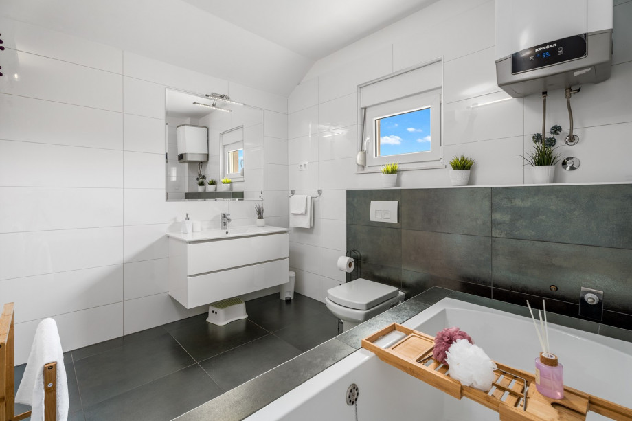 There is also a family bathroom with a bathtub