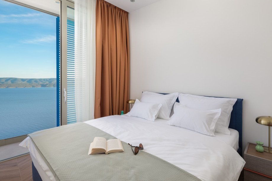 Bedroom NO3 (10 sqm) a king-size bed, a TV, an attached bathroom with a shower, and a balcony.