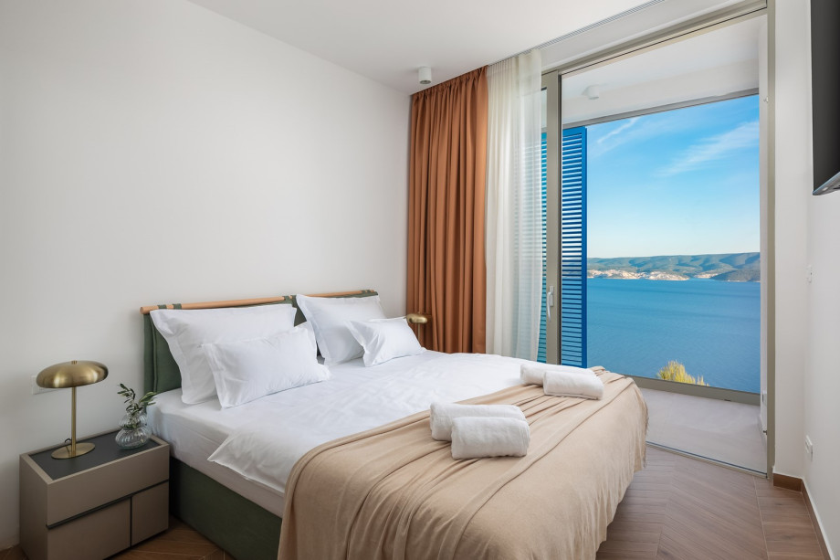 Bedroom NO4 (11 sqm) a king-size bed, a TV, an attached bathroom with a shower, and a balcony.