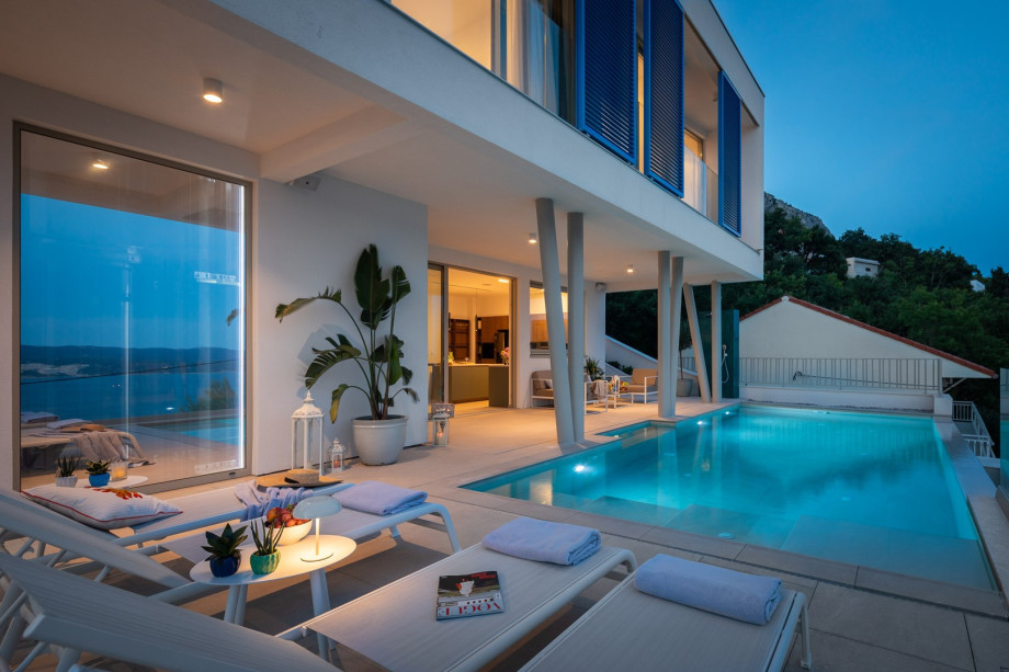 sun deck area (29sqm) with eight deck chairs, a lounge corner, and an outdoor shower