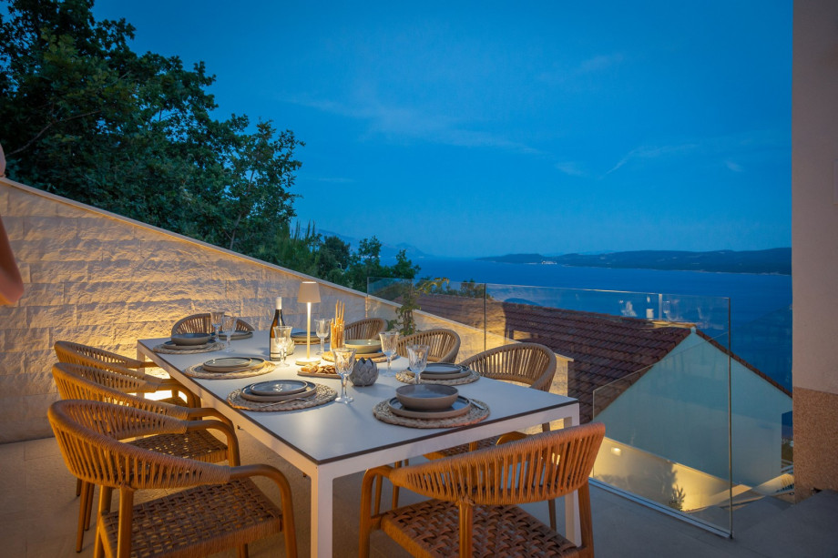 a shaded dining area for eight people, and a barbeque (woods/charcoal)