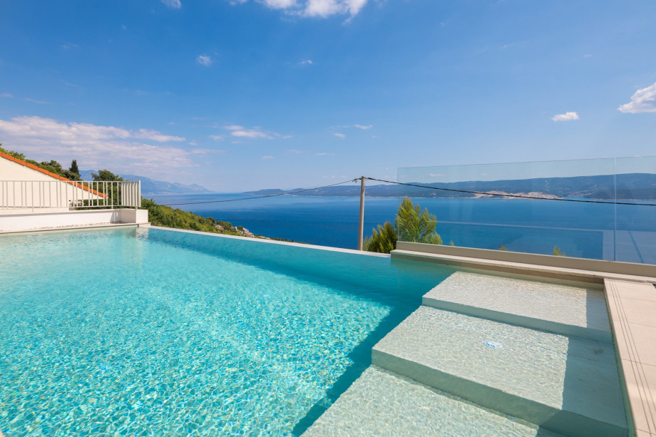 pool area with panoramic views of the island and sea