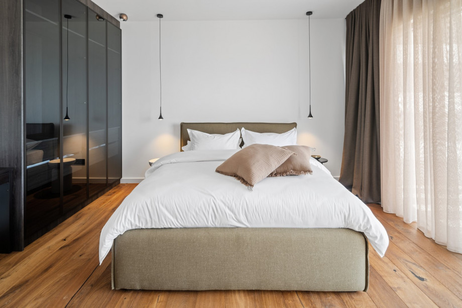 - Bedroom No. 2 (23sqm, South-East): Featuring a queen-size bed (160cm x 200cm), also with an en-suite bathroom and private terrace.