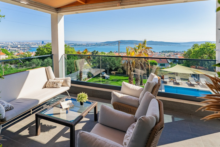 Seating area on the first floor by sunset and sea view