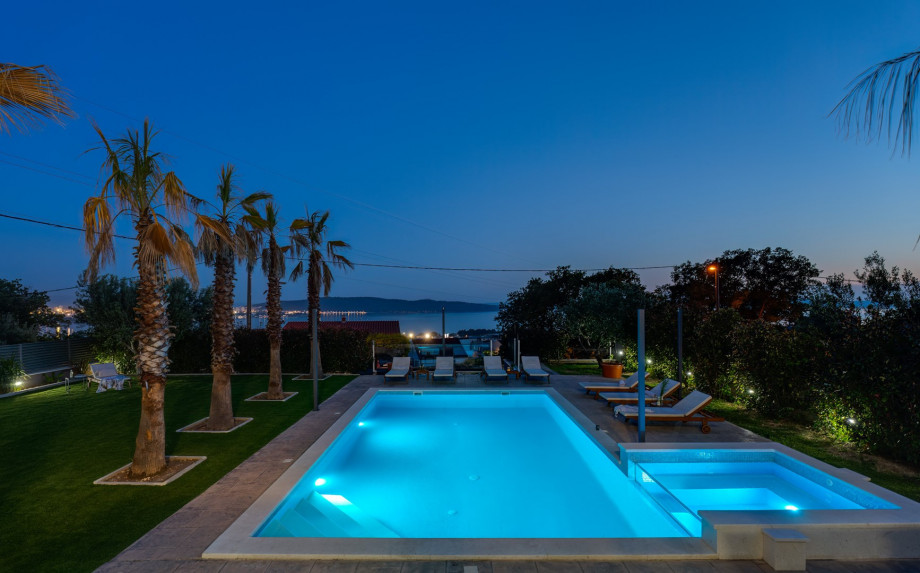 Private swimming pool with the countercurrent program and attached Whirpool