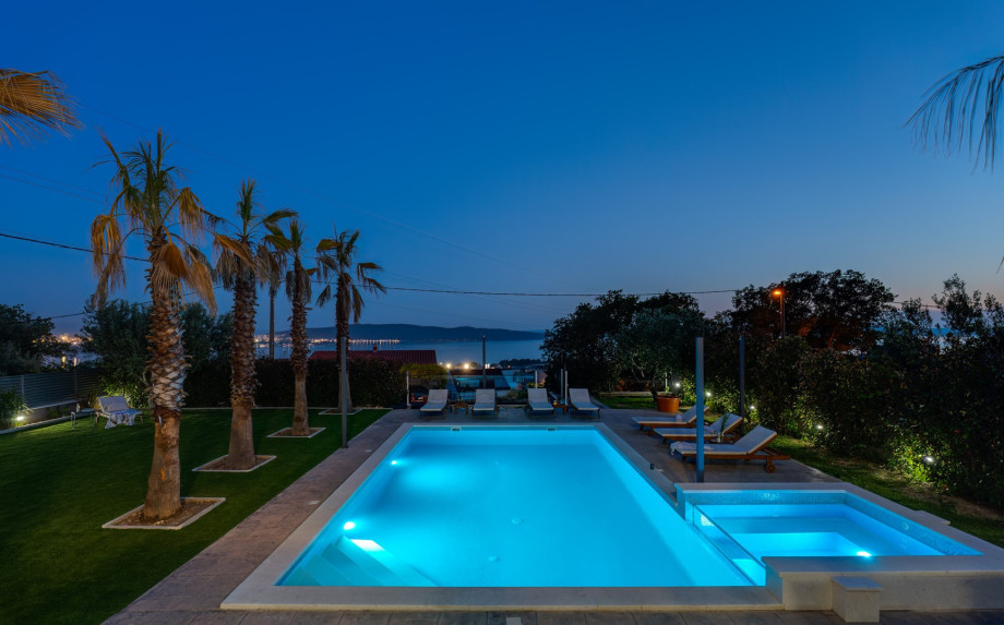 Private swimming pool with the countercurrent program and attached Whirpool