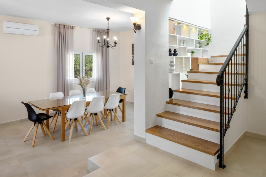 The interior is outfitted with top-quality furnishings and expertly chosen details, creating a captivating and inviting atmosphere.