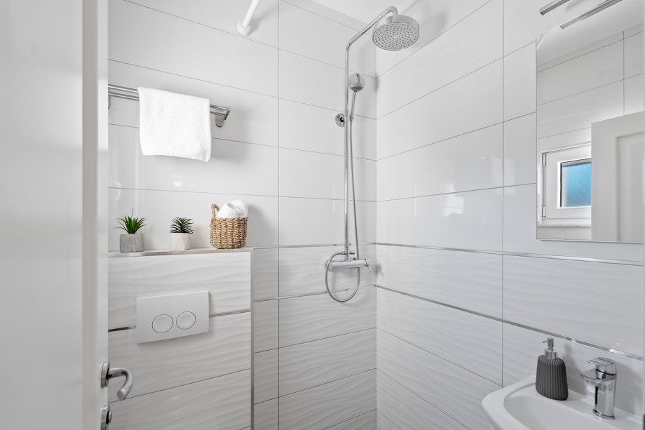 A family bathroom with a shower.