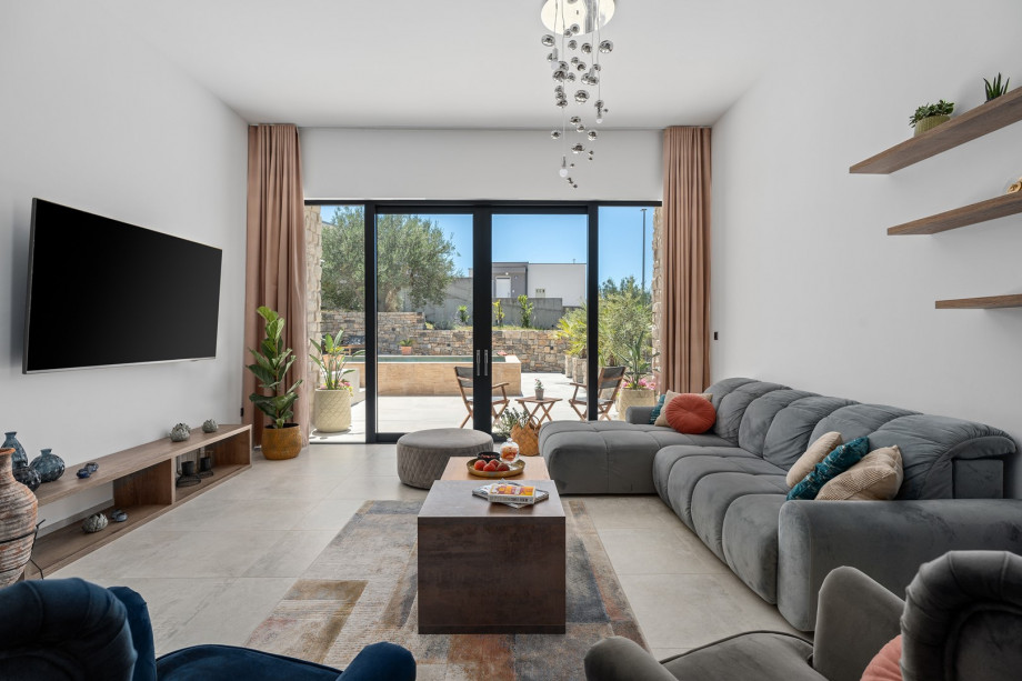 Indoor ground floor offers an air-conditioned dining area for 8 with exit toward outdoor dining area