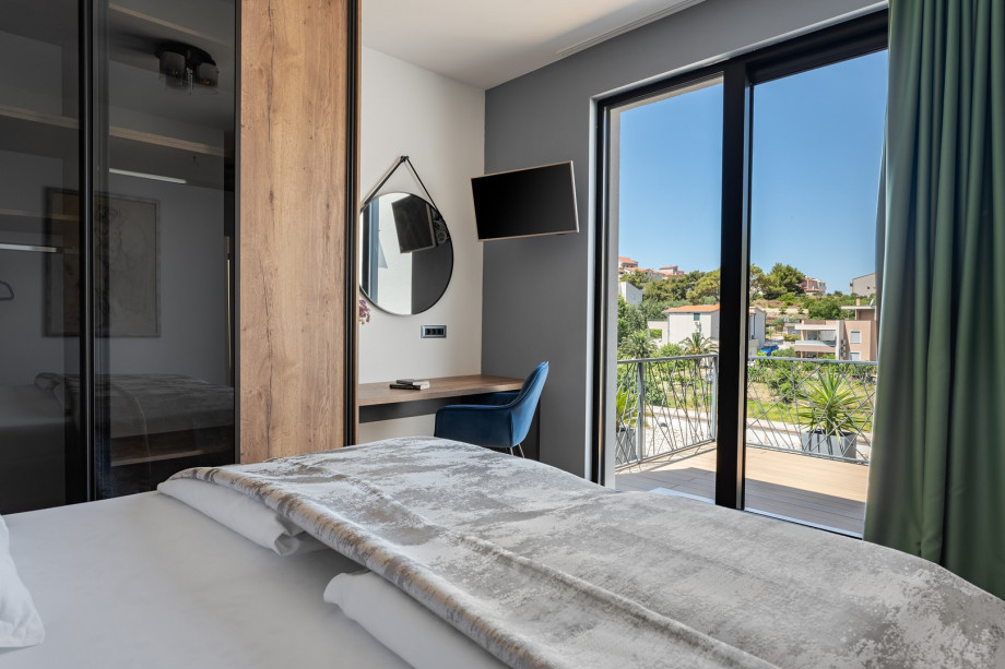 The first floor offers a Bedroom No2 (16sqm, South) with King size bed 180cm x 200cm,