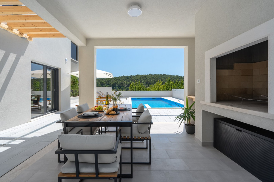 a covered dining area for 8 people