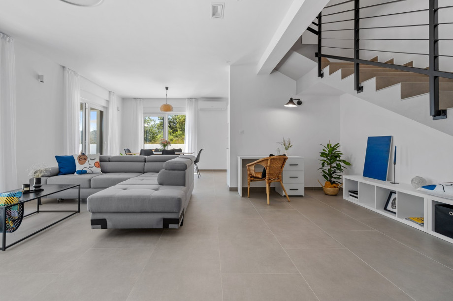 a stylish living area (42sqm) with flat screen TV, A/C, direct exit to outdoor dining area and pool