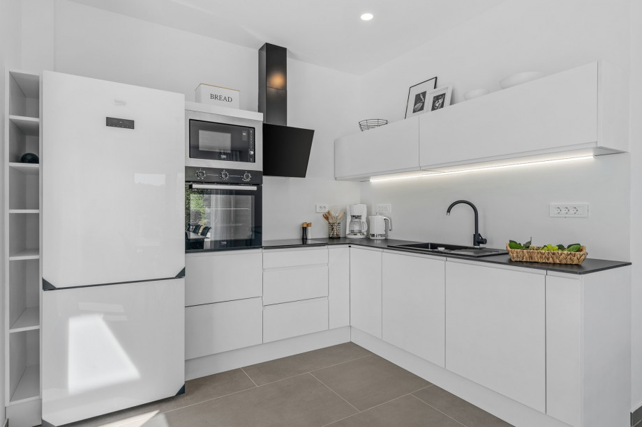 A fully equipped kitchen with all the amenities you need for a comfortable stay