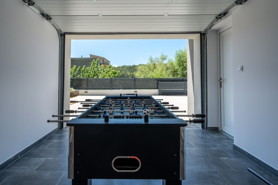 outdoor table tennis. and table soccer in the garage area