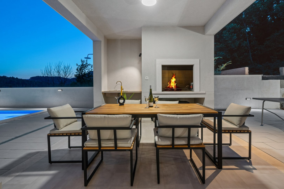 a covered dining area for 8 people
