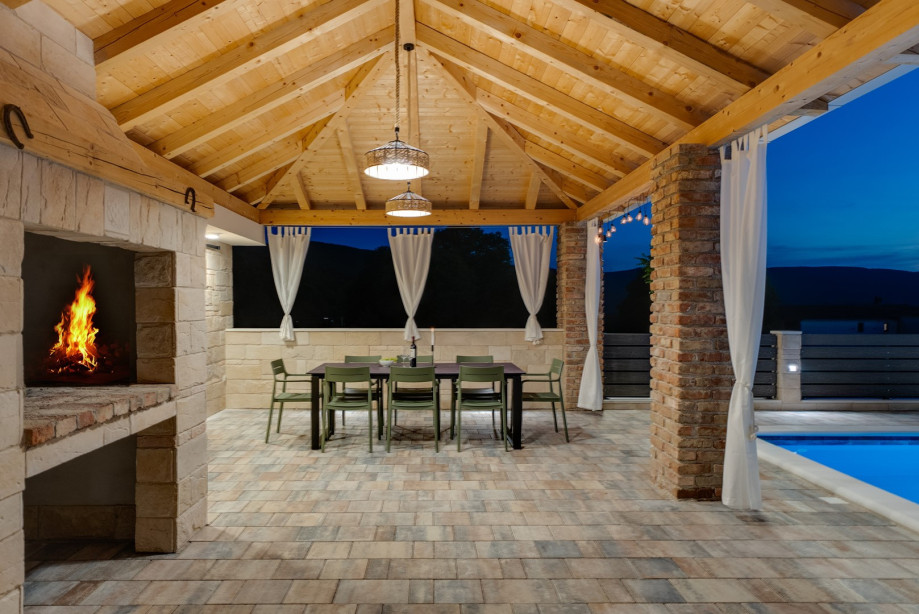Step outside to discover your very own private retreat: a covered dinning area