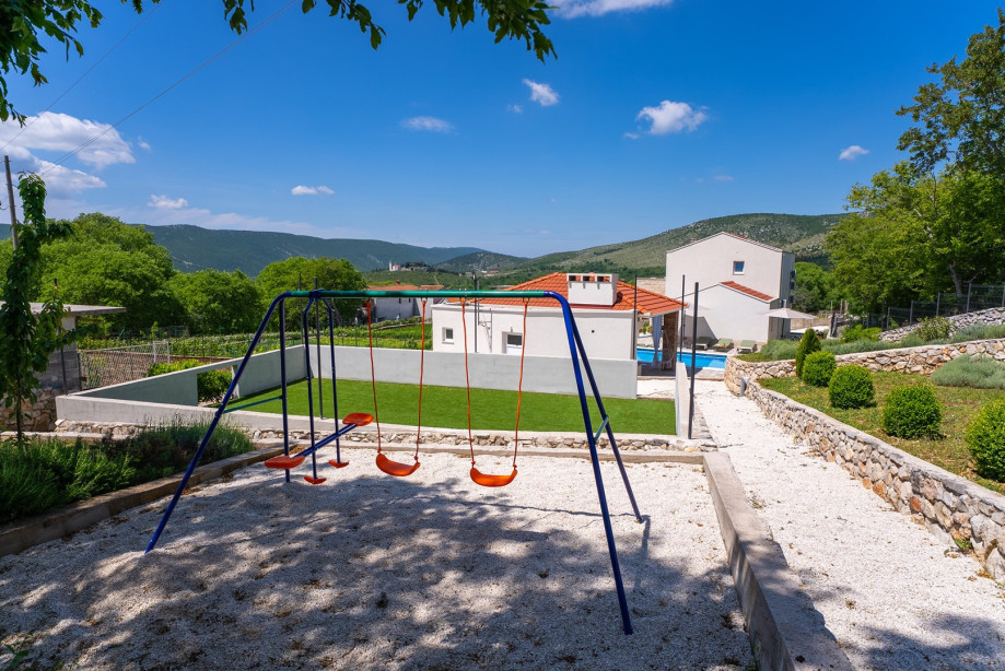 A fun-filled playground with a
Mini football - basketball setup, a Badminton setup